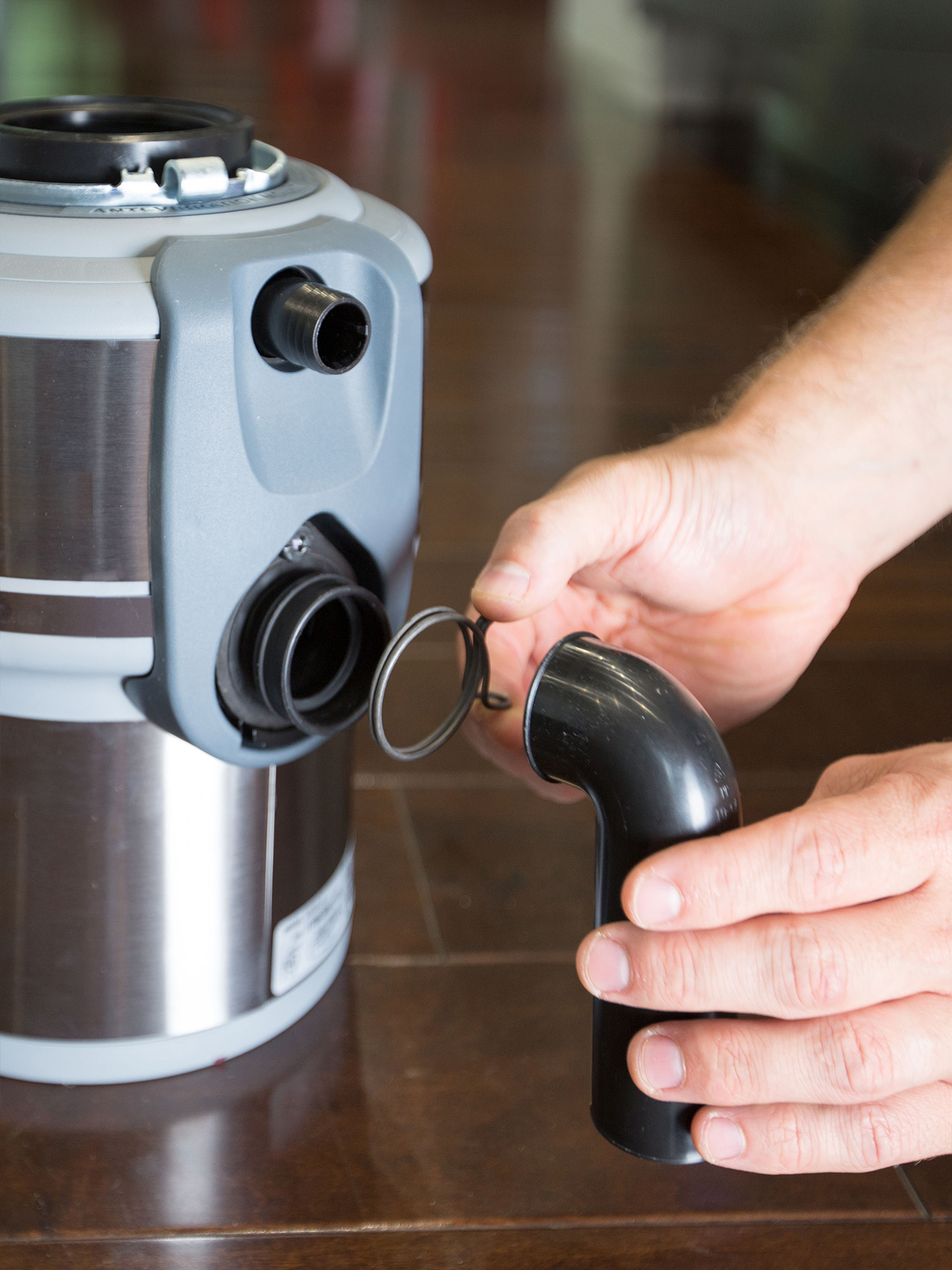 how to remove a garbage disposal snap ring