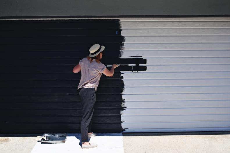 Woman Paints Garage Door Dark Blue