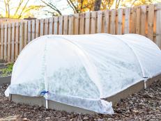 Extend your cool-weather growing season and even get a jump on spring with a DIY hoop house frame to cover a raised bed.