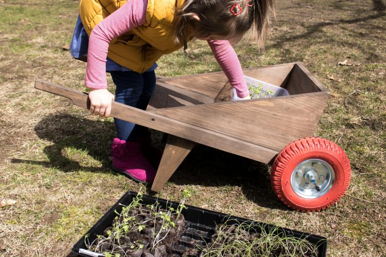 Step-by-step instructions for how to make a small wheelbarrow for your kids.