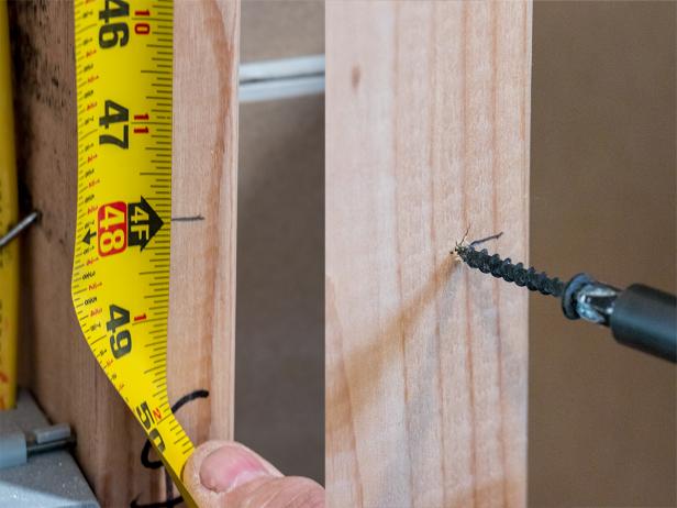 Drywall is heavy! Use screws to create a ledge to support the weight of the upper sections of sheetrock.