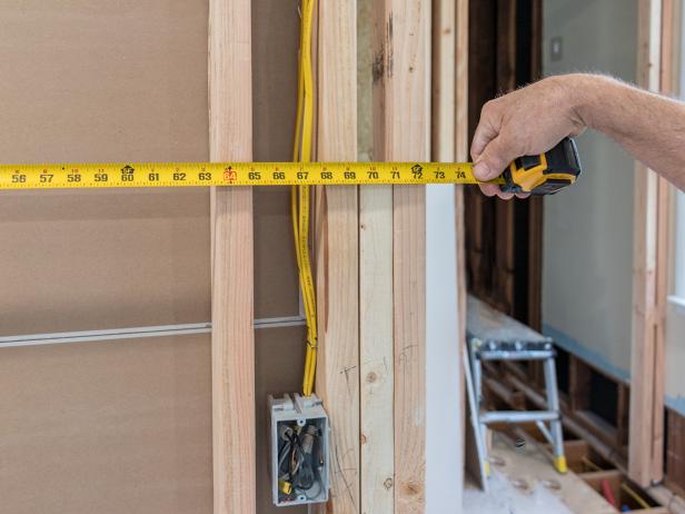 Use a tape measure to determine how much drywall you'll need.
