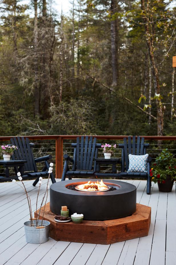 The firepit with a clean and modern look connects to the home’s propane system and serves as a versatile heating source for one of the deck’s seating areas. “The circular shape of the firepit is a nod to the octagon deck,” says project manager Dylan Eastman. 