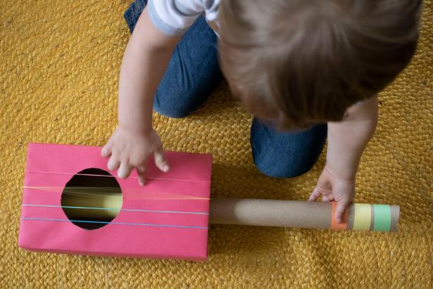 DIY cardboard box guitar for toddlers