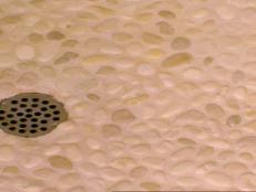 Pebble tile sheets create the shower floor.