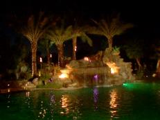 View of a pool with a fire feature.