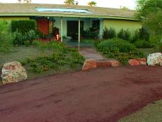 The new landscape and curved front driveway complete this yard's transformation