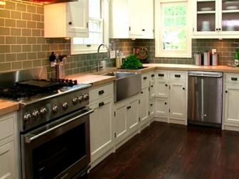 A renovated kitchen that has been opened up to become larger by removing a wall.