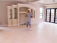 Vanilla Ice prepares to demolish a dated wall unit in a home that he is renovating to make room for a new home theater.