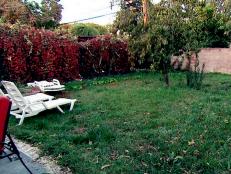 A backyard before it will be transformed with all new features for the homeowners.