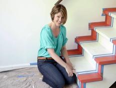 Sharon Kaye painting stripes on decorative stairs.